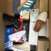 The photo shows a package with footwear in the category BS.