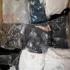 GB370 1 The photo shows a package with clothing in the category B.