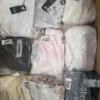 The photo shows a package with clothing in the category B.