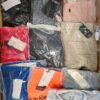 The photo shows a package with clothing in the category AM.
