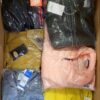The photo shows a package with clothing in the category AJS.