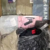 The photo shows a package with clothing in the category AM.