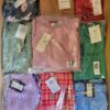 The photo shows a package with clothing in the category AR.
