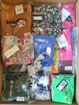 The photo shows a package with clothing in the category AR.