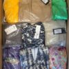 The photo shows a package with clothing in the category AR.