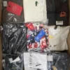 The photo shows a package with clothing in the category AM.