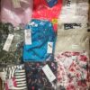The photo shows a package with clothing in the category AR.