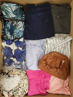The photo shows a package with clothing in the category TSC.