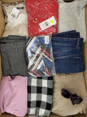 The photo shows a package with clothing in the category TSC.