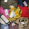 The photo shows a package with clothing in the category TSC.