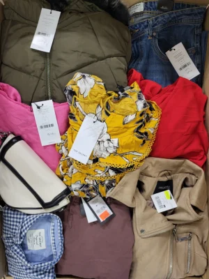 The photo shows a package with clothing in the category TSC.