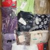 The photo shows a package with clothing in the category AW.