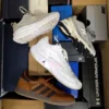The photo shows a package with footwear in the category CS.