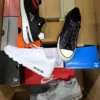 The photo shows a package with footwear in the category CS.
