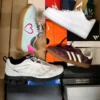 The photo shows a package with footwear in the category CS.