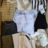 The photo shows a package with clothing in the category TSC.