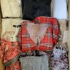 The photo shows a package with clothing in the category TSC.