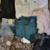 The photo shows a package with clothing in the category TSC.