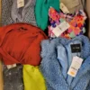 The photo shows a package with clothing in the category TSC.