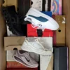 The photo shows a package with footwear in the category CS.