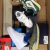 The photo shows a package with footwear in the category CS.