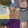 The photo shows a package with clothing in the category TSC.
