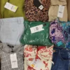 The photo shows a package with clothing in the category TSC.