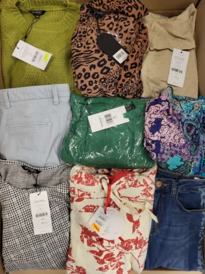 The photo shows a package with clothing in the category TSC.