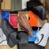 The photo shows a package with footwear in the category CS.
