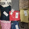 The photo shows a package with clothing in the category TSC.