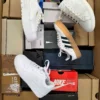 The photo shows a package with footwear in the category CS.