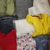 The photo shows a package with clothing in the category TSC.