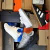 The photo shows a package with footwear in the category CS.