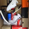 The photo shows a package with footwear in the category CS.