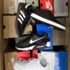 The photo shows a package with footwear in the category CS.