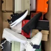 The photo shows a package with footwear in the category CS.