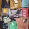 The photo shows a package with clothing in the category AW.