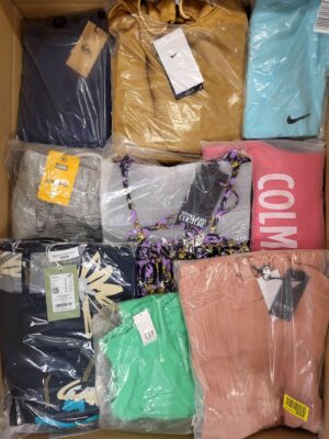 The photo shows a package with clothing in the category AW.