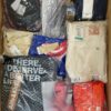 The photo shows a package with clothing in the category AW.