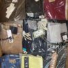 The photo shows a package with clothing in the category AW.