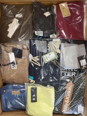The photo shows a package with clothing in the category AW.