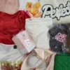 The photo shows a package with clothing in the category SN.