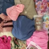 The photo shows a package with clothing in the category SN.