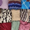 The photo shows a package with clothing in the category SN.