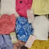 The photo shows a package with clothing in the category SN.