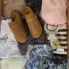 The photo shows a package with clothing in the category SN.