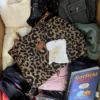 The photo shows a package with clothing in the category SN.