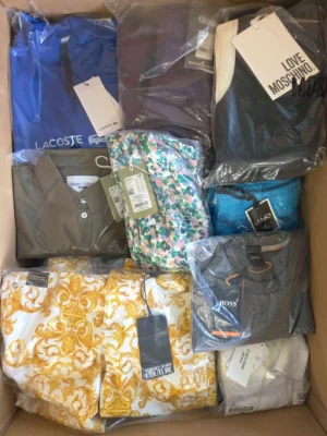 The photo shows a package with clothing in the category AP.