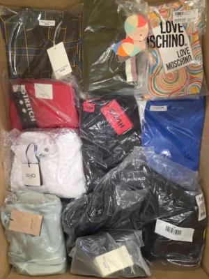 The photo shows a package with clothing in the category AP.