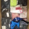 The photo shows a package with clothing in the category AP.